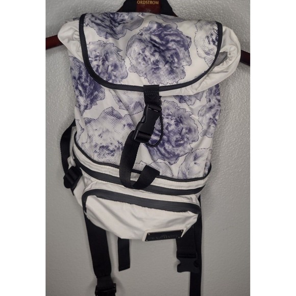 adidas by stella mccartney weekender backpack 24/7 BAG, 10.5" x 19.75" x 11", Semi Solar Slime/Black/Glow Blue Two side pockets store water bottles while a laptop sleeve and interior pockets keep more delicate items stowed away Luxury fashion & independent designers